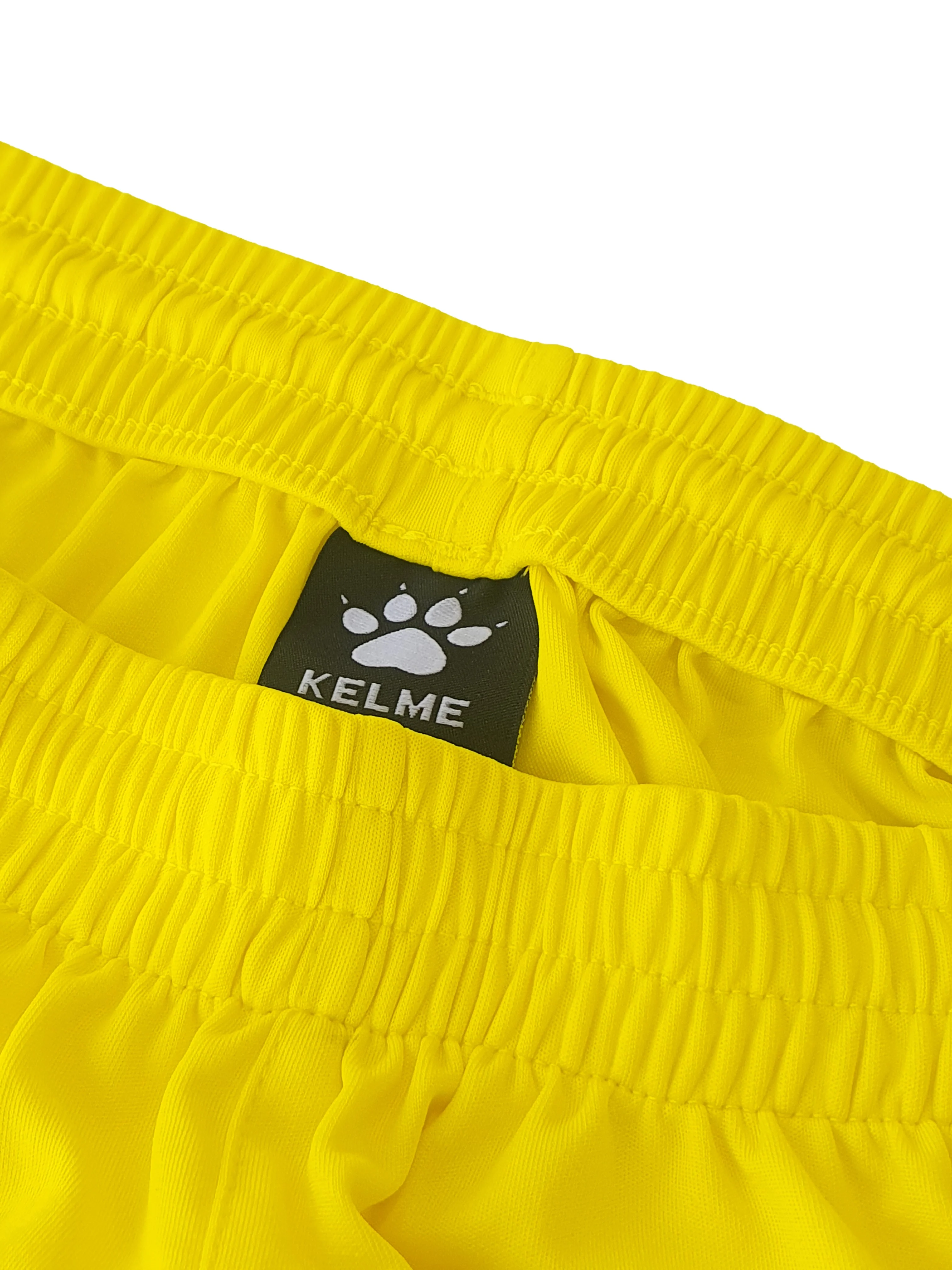 PANTALÓN CORTO GLOBAL AMARILLO - Image 3