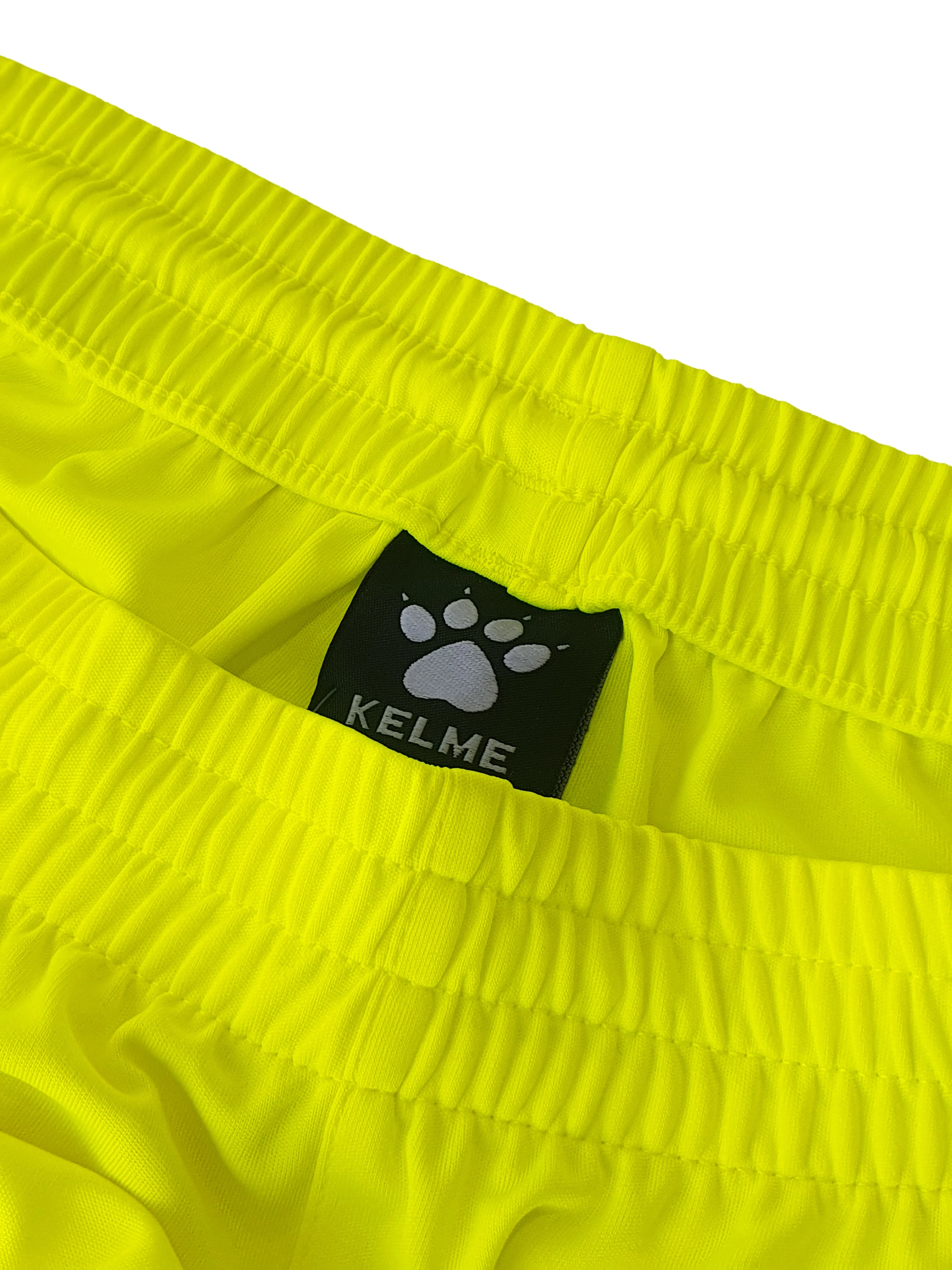 PANTALÓN CORTO GLOBAL AMARILLO - Image 3